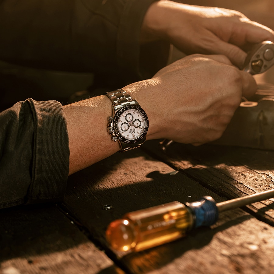 Close up of Cosmograph Daytona watch on a mans wrist