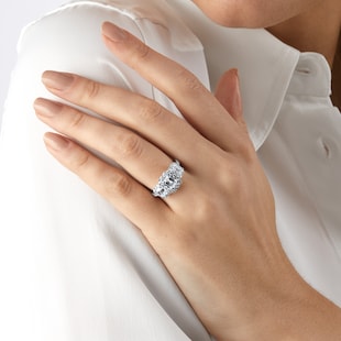 Mappin & Webb Amelia Platinum 2.50cttw Emerald Cut 3 Stone Diamond Halo Ring
