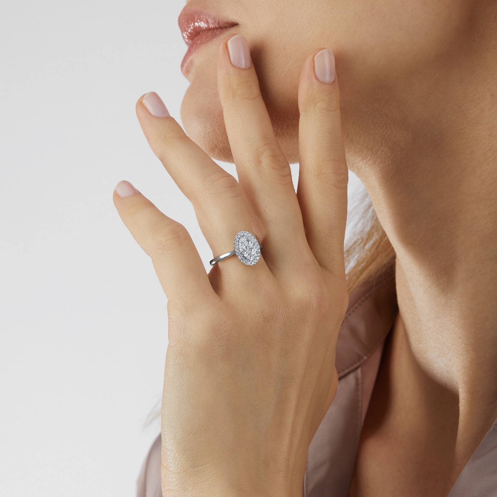 Goldsmiths Platinum 0.75ct Diamond Oval Cluster Engagement Ring Goldsmiths Platinum 0.75ct Diamond Oval Cluster Engagement Ring