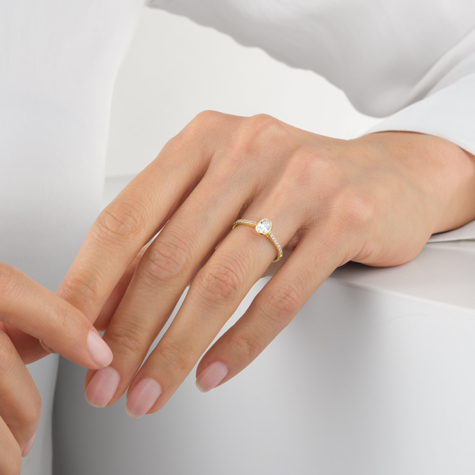 Goldsmiths 18ct Yellow Gold 0.53cttw Diamond Set Shoulder and Bezel Set Oval Cut Solitaire Engagement Ring Goldsmiths 18ct Yellow Gold 0.53cttw Diamond Set Shoulder and Bezel Set Oval Cut Solitaire Engagement Ring