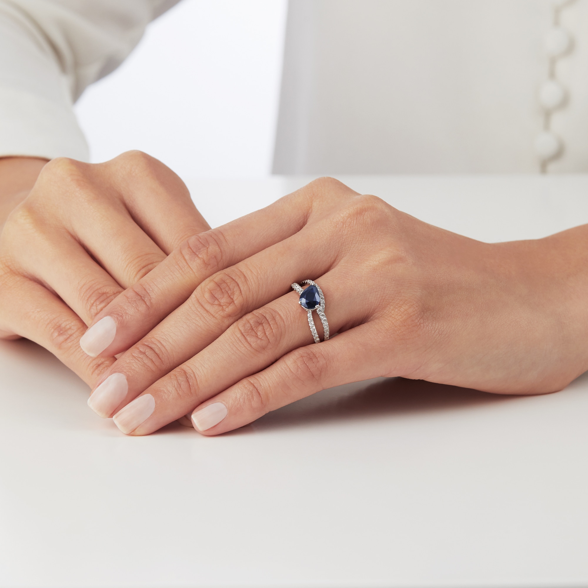 Twisted sapphire clearance ring