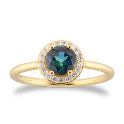 06110337 - 18ct Yellow Gold Teal Sapphire 
0.11ct Diamond Halo Ring