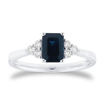 Goldsmiths Platinum Emerald Cut Sapphire and 0.20cttw Diamond Three Stone Engagement Ring Goldsmiths Platinum Emerald Cut Sapphire and 0.20cttw Diamond Three Stone Engagement Ring