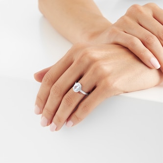 Goldsmiths 9ct White Gold Aquamarine & Diamond Halo Ring Goldsmiths 9ct White Gold Aquamarine & Diamond Halo Ring