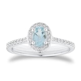 Goldsmiths 18ct White Gold 0.52cttw Oval Aquamarine and 0.20cttw Diamond Halo Ring