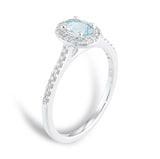 Goldsmiths 18ct White Gold 0.52cttw Oval Aquamarine and 0.20cttw Diamond Halo Ring