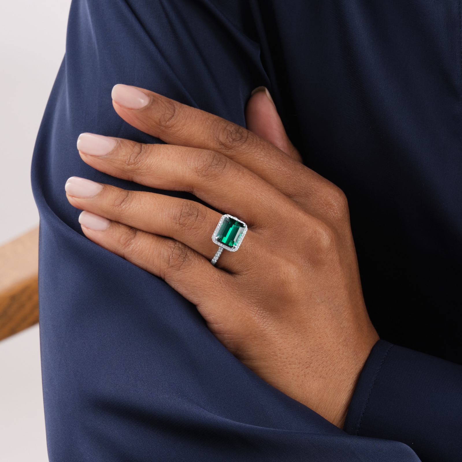 Goldsmiths Platinum Green Tourmaline and 0.25cttw Diamond Halo Ring