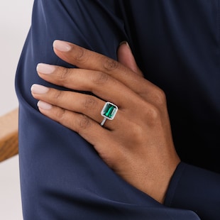 Goldsmiths Platinum Green Tourmaline and 0.25cttw Diamond Halo Ring