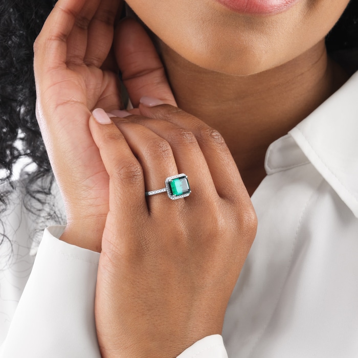Goldsmiths Platinum Green Tourmaline and 0.25cttw Diamond Halo Ring