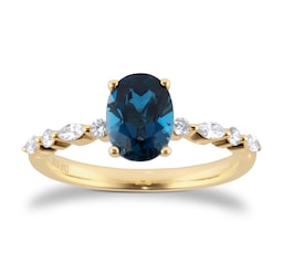 06290019 - 18ct Yellow Gold Oval Cut Blue Topaz Diamond Set Shoulder Ring