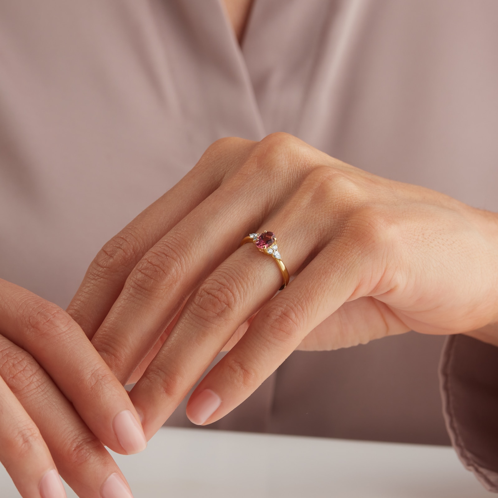 Goldsmiths 18ct Yellow Gold Oval Cut Pink Tourmaline and 0.20cttw Diamond Engagement Ring Goldsmiths 18ct Yellow Gold Oval Cut Pink Tourmaline and 0.20cttw Diamond Engagement Ring