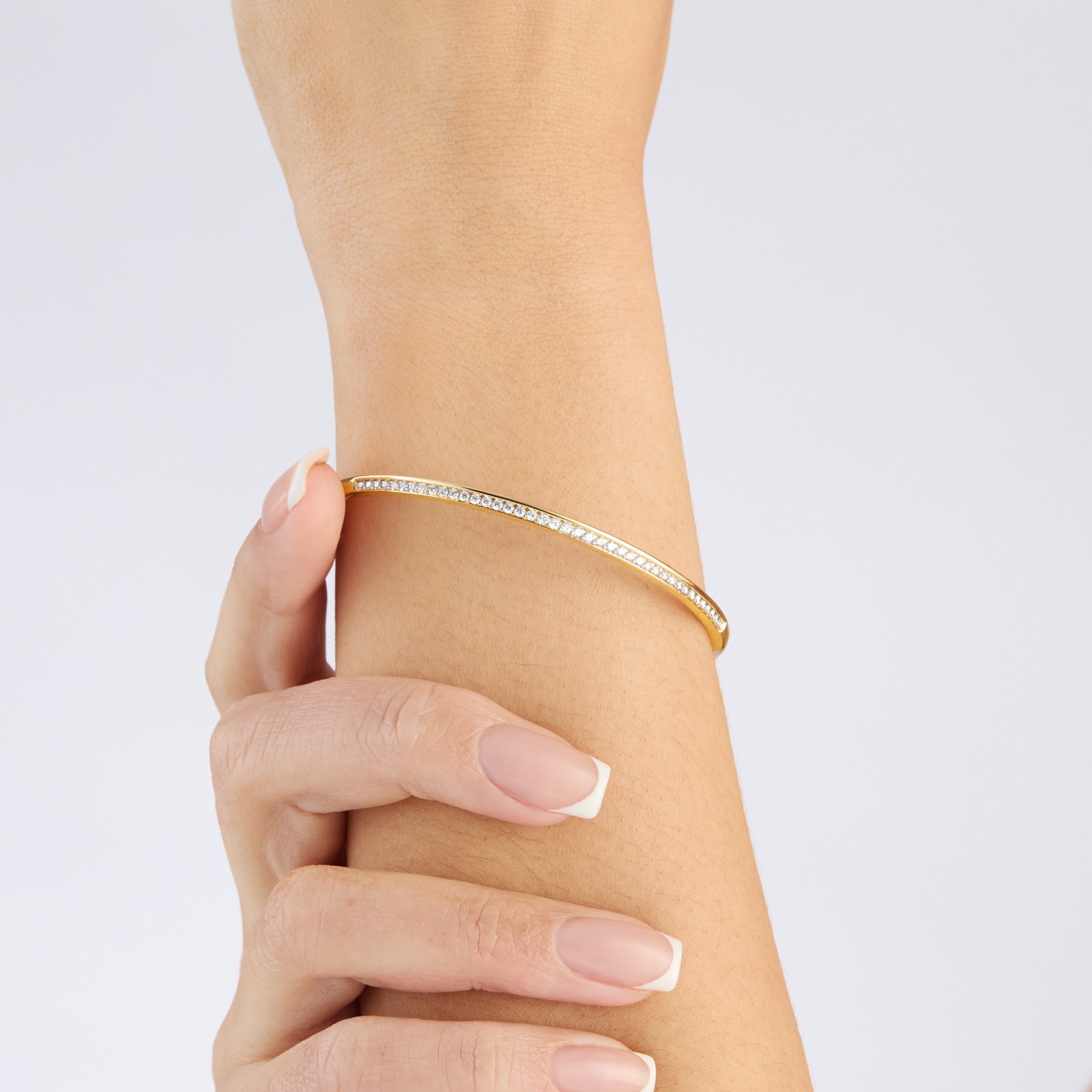 Goldsmiths 9ct Yellow Gold 0.70cttw Diamond and Plain Row Bangle Goldsmiths 9ct Yellow Gold 0.70cttw Diamond and Plain Row Bangle