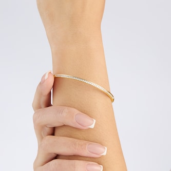Goldsmiths 9ct Yellow Gold 0.70cttw Diamond and Plain Row Bangle Goldsmiths 9ct Yellow Gold 0.70cttw Diamond and Plain Row Bangle