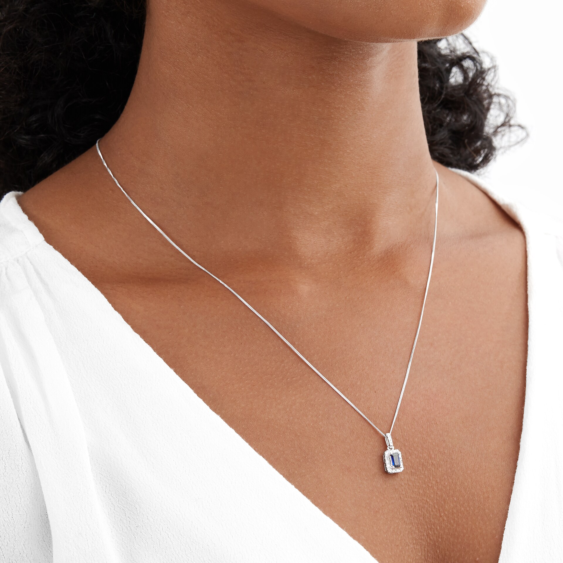 Goldsmiths 9ct White Gold Sapphire and Diamond Halo Pendant Goldsmiths 9ct White Gold Sapphire and Diamond Halo Pendant