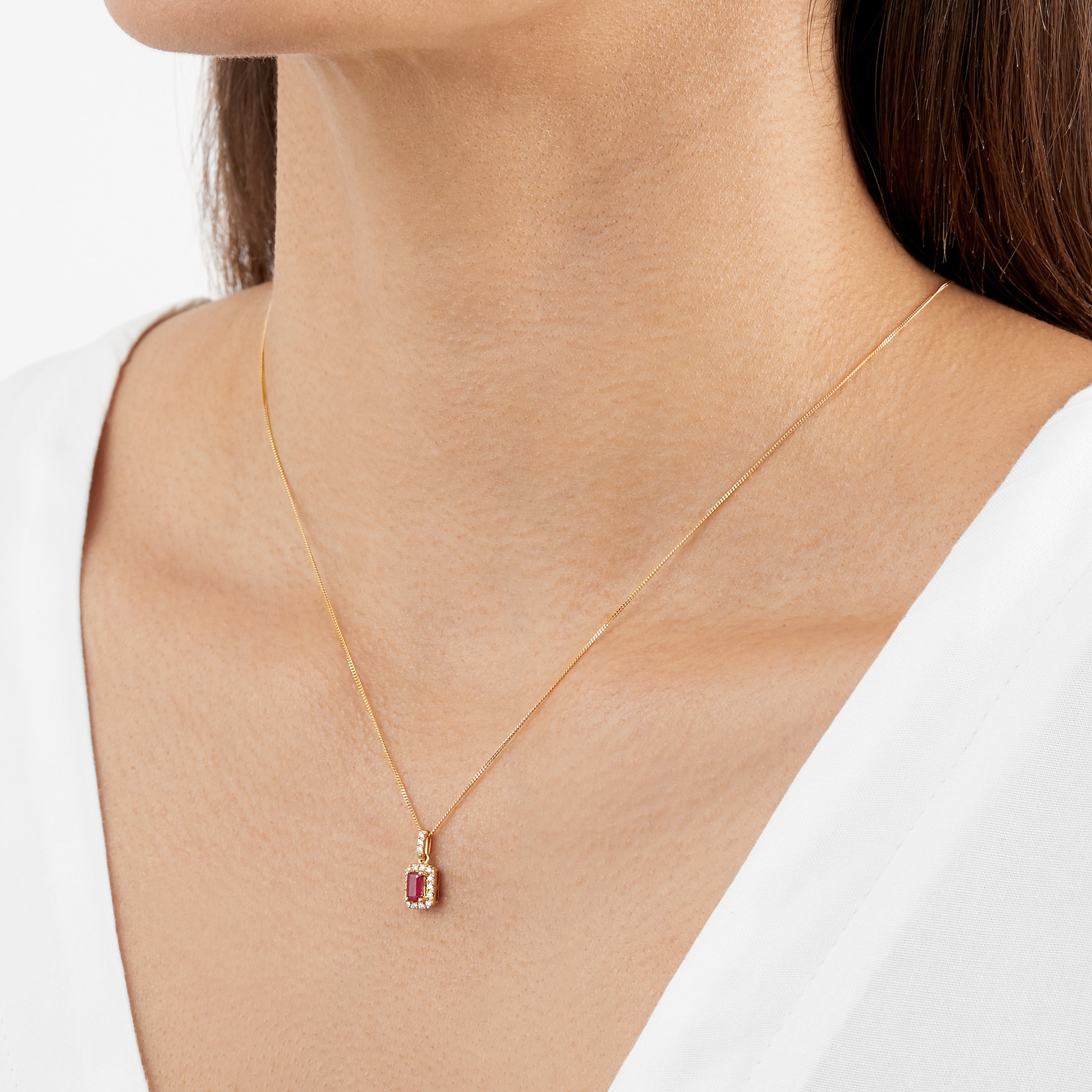 Goldsmiths 9ct Yellow Gold Emerald Cut Ruby & Diamond Halo Pendant