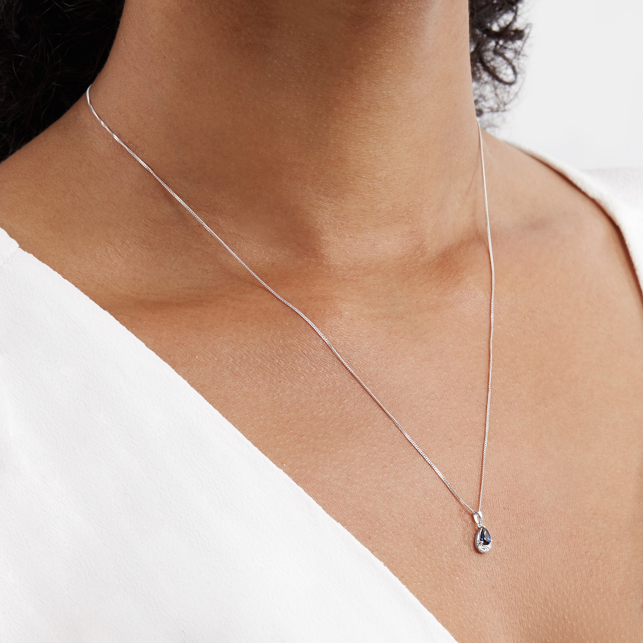 Goldsmiths 9ct White Gold Pear Cut Sapphire & Diamond Pendant Goldsmiths 9ct White Gold Pear Cut Sapphire & Diamond Pendant