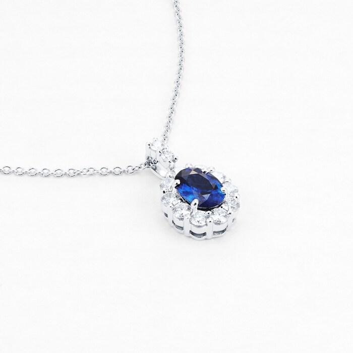 Mappin & Webb 18ct White Gold Oval Cut Sapphire and Diamond Halo Pendant