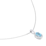 Goldsmiths 9ct White Gold Oval Blue Topaz and 0.10cttw Diamond Halo Pendant