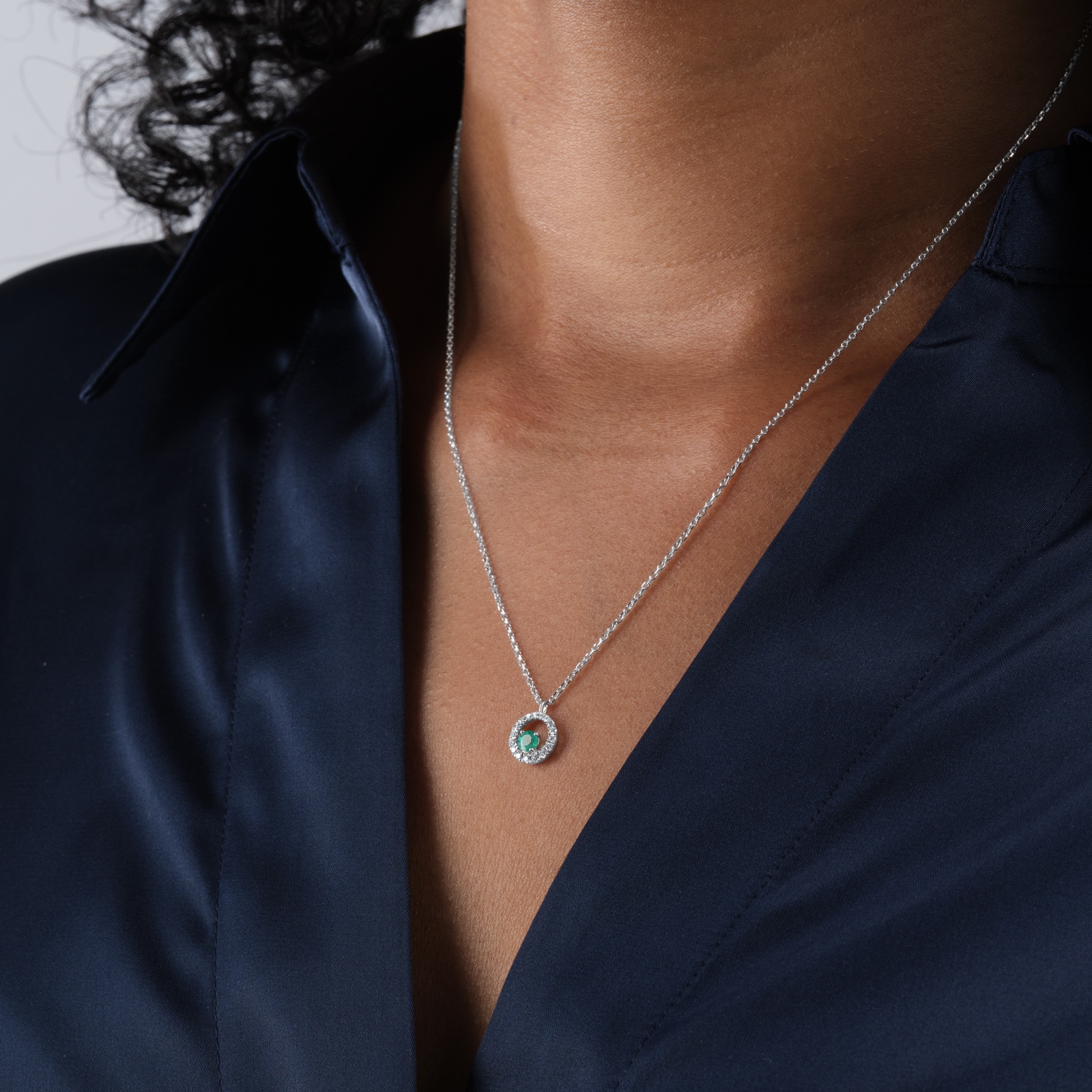 Goldsmiths 9ct White Gold Brilliant Cut Emerald and Diamond Halo Pendant Goldsmiths 9ct White Gold Brilliant Cut Emerald and Diamond Halo Pendant
