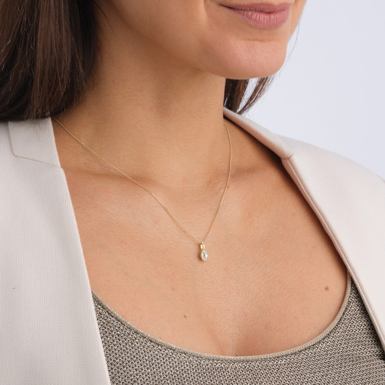 Goldsmiths 9ct Yellow Gold 0.20cttw Oval Halo Diamond Pendant