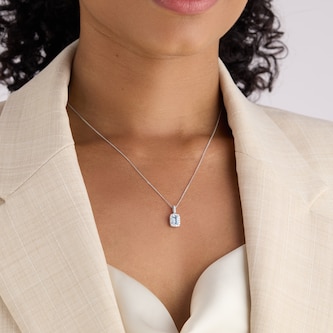 Goldsmiths 9ct White Gold 0.15cttw Diamond and Emerald Cut Aquamarine Halo Pendant Goldsmiths 9ct White Gold 0.15cttw Diamond and Emerald Cut Aquamarine Halo Pendant