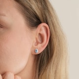 Goldsmiths 9ct White Gold Oval Blue Topaz and 0.10cttw Diamond Halo Stud Earrings