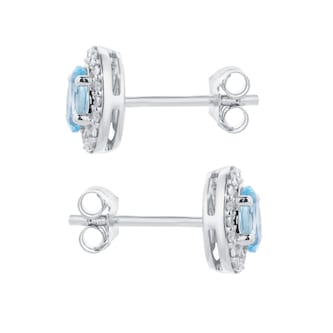 Goldsmiths 9ct White Gold Oval Blue Topaz and 0.10cttw Diamond Halo Stud Earrings Goldsmiths 9ct White Gold Oval Blue Topaz and 0.10cttw Diamond Halo Stud Earrings