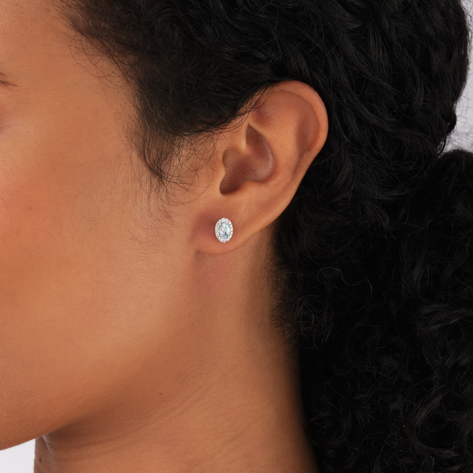 Goldsmiths 9ct White Gold Oval Aquamarine and 0.10cttw Diamond Halo Stud Earrings Goldsmiths 9ct White Gold Oval Aquamarine and 0.10cttw Diamond Halo Stud Earrings