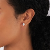 Goldsmiths 9ct White Gold Oval Aquamarine and 0.10cttw Diamond Halo Stud Earrings