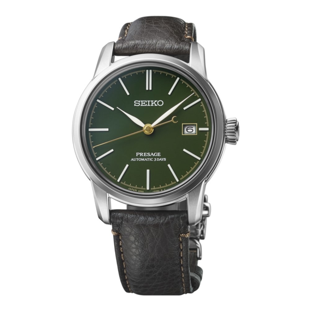 Silver watch with green on sale face