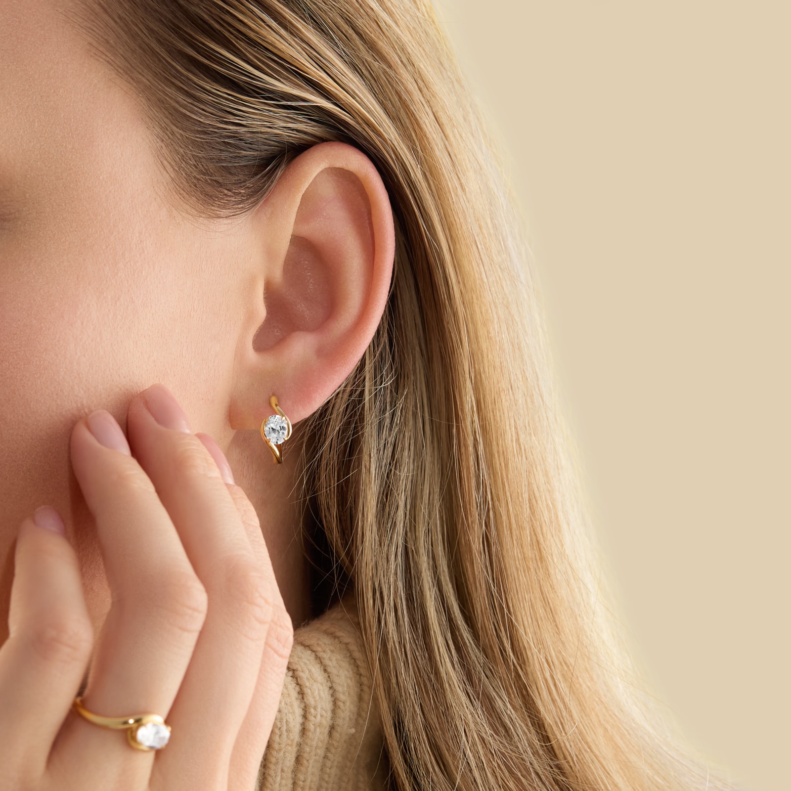 Goldsmiths 9ct Yellow Gold 1.00cttw Oval Cut Lab Grown Diamond Soitaire Fluid Hoop Earrings Goldsmiths 9ct Yellow Gold 1.00cttw Oval Cut Lab Grown Diamond Soitaire Fluid Hoop Earrings