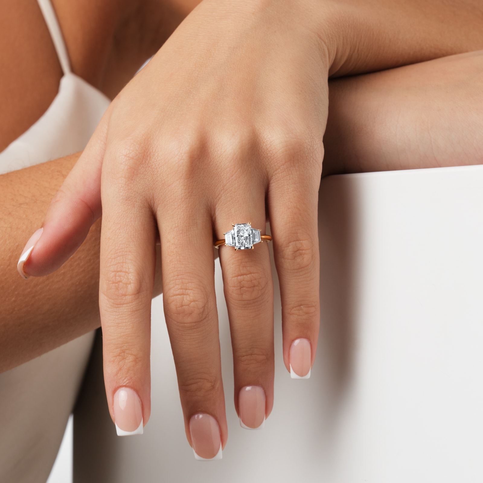 Goldsmiths 18ct Yellow Gold 2.70cttw Radiant and Trapezoid Cut Lab Grown Diamond 3 Stone Engagement Ring Goldsmiths 18ct Yellow Gold 2.70cttw Radiant and Trapezoid Cut Lab Grown Diamond 3 Stone Engagement Ring