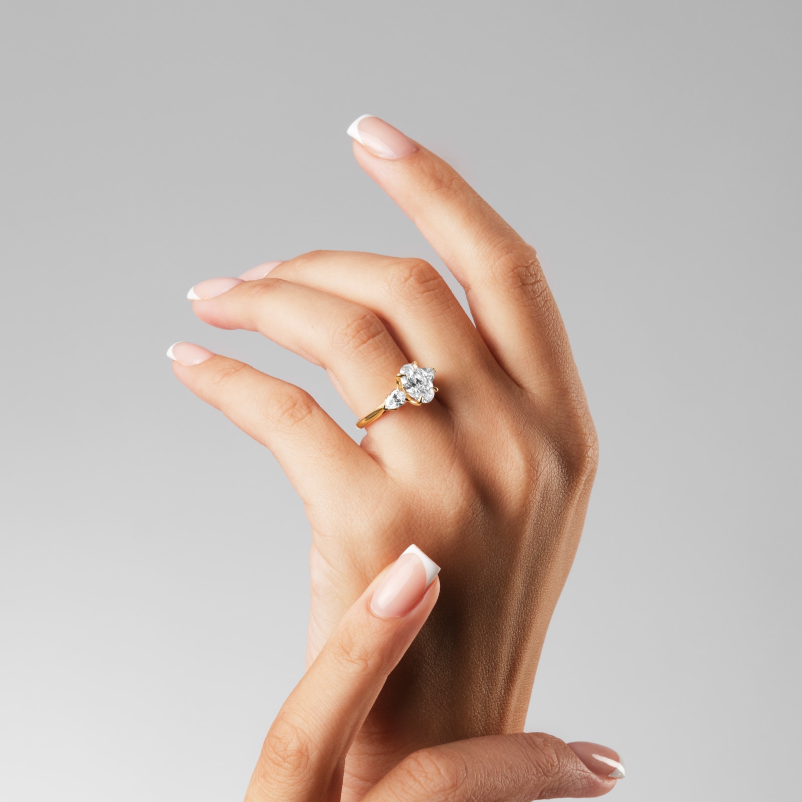 Goldsmiths 18ct Yellow Gold 2.66cttw Oval and Pear Cut Lab Grown Diamond 3 Stone Engagement Ring Goldsmiths 18ct Yellow Gold 2.66cttw Oval and Pear Cut Lab Grown Diamond 3 Stone Engagement Ring